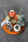 A circular lacquered Chinese table compass and assorted Chinese items to include patinated figure