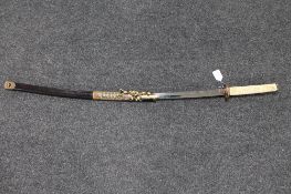 A Japanese katana in sheath with an ornate resin handle