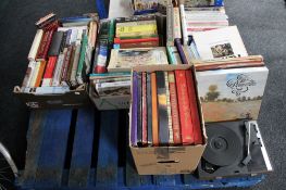A pallet of hardback and paperback books,