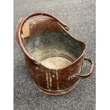 A Victorian hammered copper coal bucket
