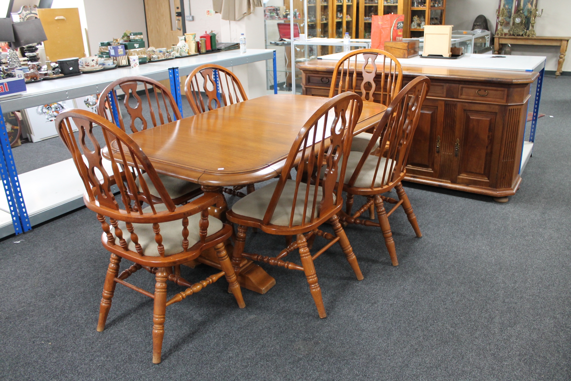 A refectory extending dining table with two leaves and six Windsor style chairs