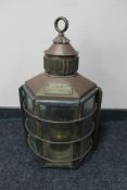 An antique copper and brass clipper ship's lamp number 1255, made in Dumbarton,