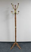 A contemporary wooden and brass hat & coat stand
