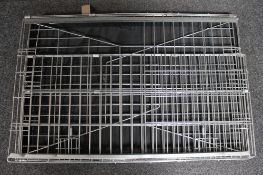 A folding metal dog cage