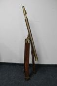 An antique style brass telescope on a brass and hardwood tripod