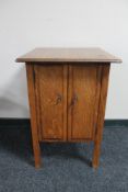 An early 20th century oak double door cabinet