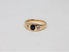 An 18ct gold diamond and sapphire three stone ring, size N CONDITION REPORT: 10.