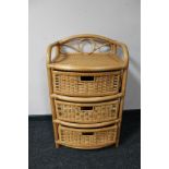 A bamboo and wicker three drawer chest