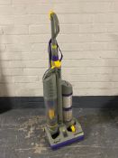 A Dyson DC 03 upright vacuum cleaner