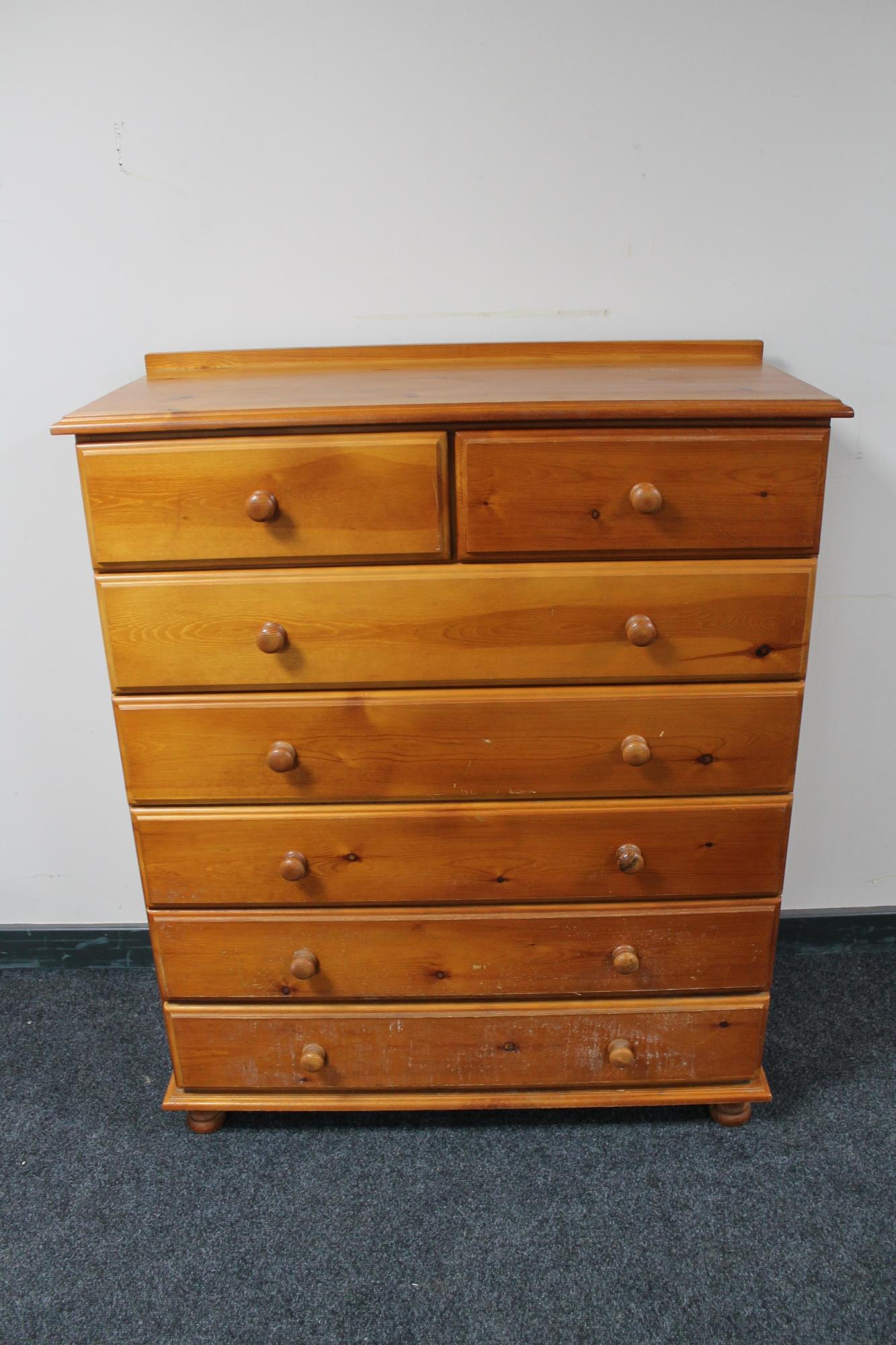 A pine seven drawer chest