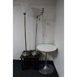A circular pedestal cafe style table,