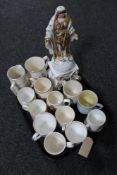 A tray of antique and later commemorative jugs and mugs together with a china religious figure