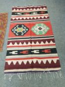 A wool Kilim rug,