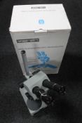 A boxed Zenit MBC-10 stereoscopic microscope