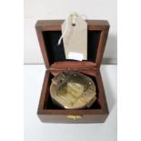 A brass cased natural sine compass in fitted box