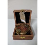 A brass cased natural sine compass by Stanley of London in fitted box