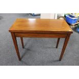 A 19th century inlaid mahogany turn over top tea table