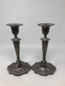 A pair of loaded silver candlesticks, Walker & Hall, Sheffield, with sconces, height 23.5cm.