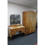 A 1930's walnut single door wardrobe together with kneehole dressing table
