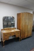 A 1930's walnut single door wardrobe together with kneehole dressing table