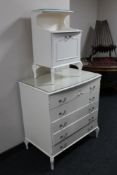 A white French style five drawer chest with matching bedside stand