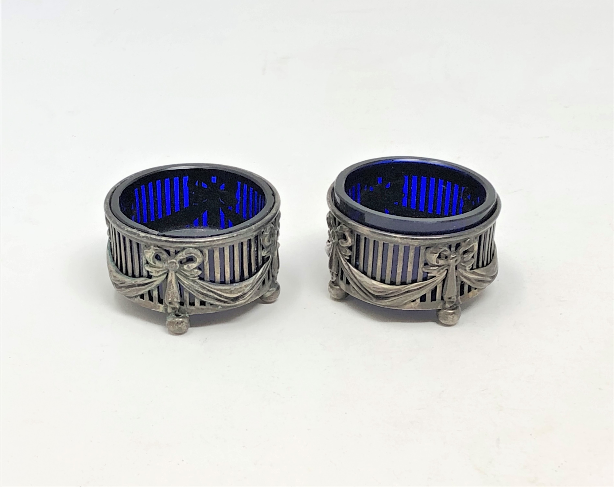 A pair of Neo-Classical silver salts with blue glass liners.
