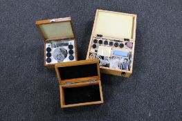 Two boxes of microscope accessories together with a further wooden box