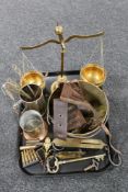 A tray of antique and later brass ware, balance scales, jam pan, spring balance, bullet casings,