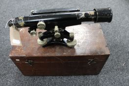 A vintage surveyor's theodolite in fitted box