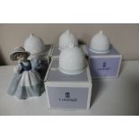 Four boxed Lladro bells together with a Nao figure of a girl