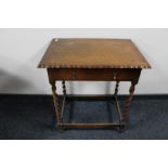 A 20th century oak pie crust edge barley twist side table fitted with a drawer