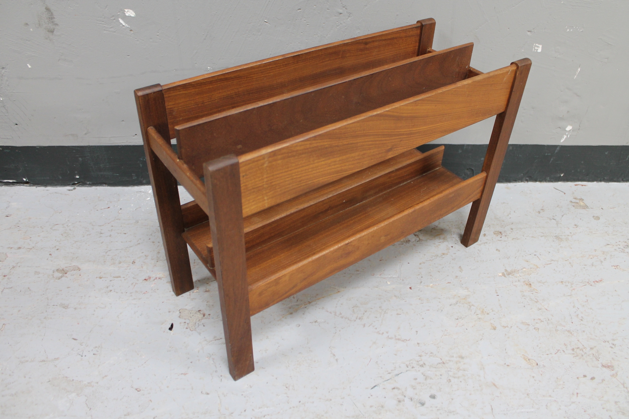 A Danish teak magazine rack