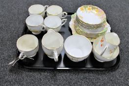 A tray of Bell tea china decorated with daffodils