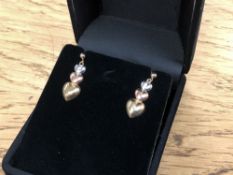 A pair of three tone 10ct gold earrings