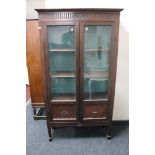 An Edwardian mahogany double door display cabinet