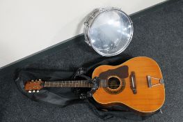 A Melody acoustic guitar in a Kisman guitar bag,