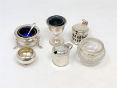 Two silver salts, two silver mustard pots, a silver egg cup,