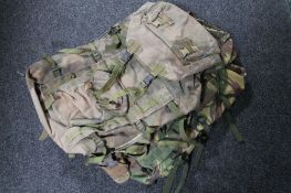 A box of four army camouflage bags