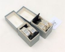 Two boxed pairs of silver napkin rings, 46.2g gross.