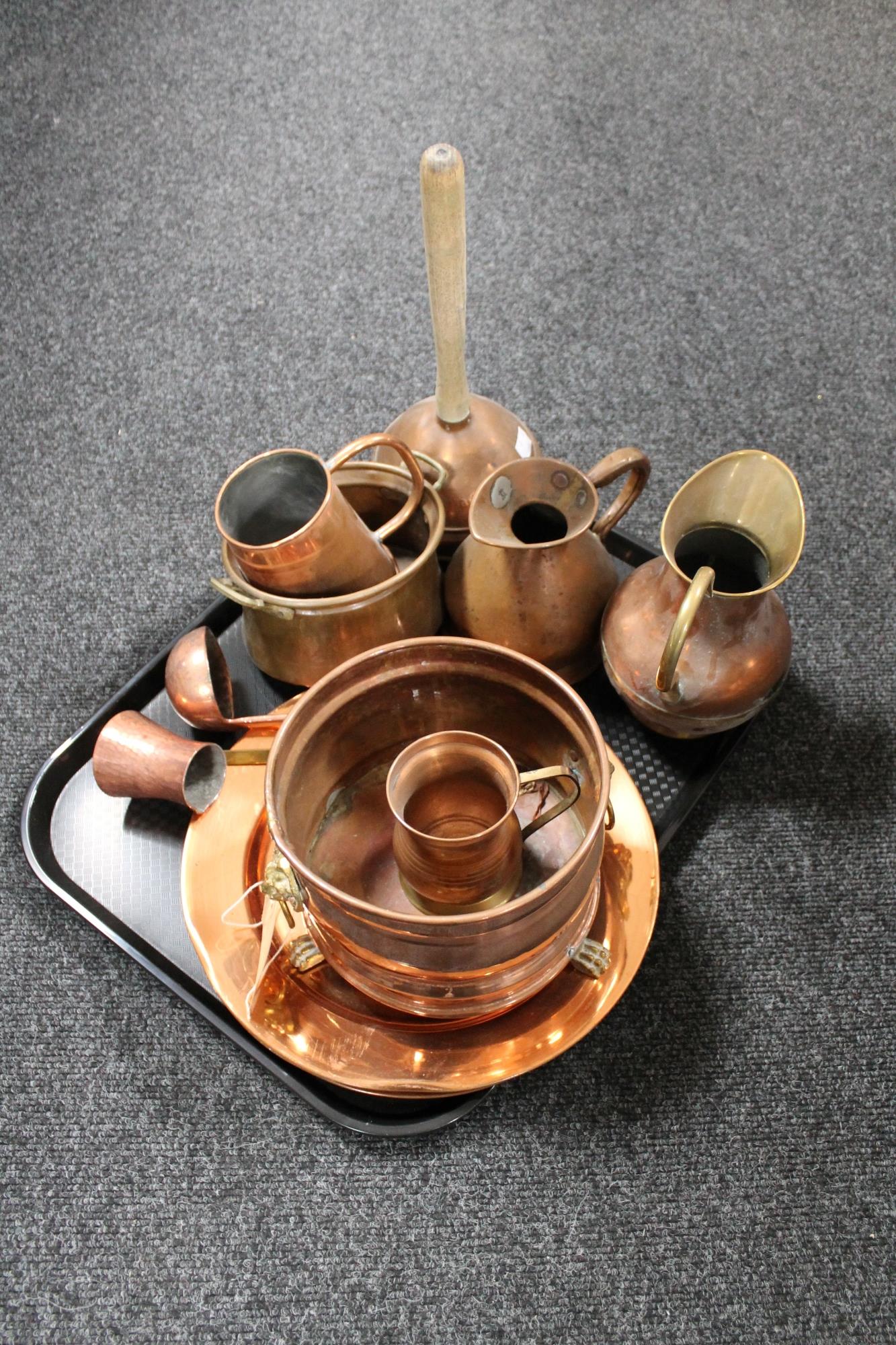 A tray of antique and later copper ware, poss stick, jugs, measures,