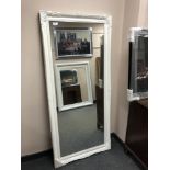 A rectangular white painted mirror,