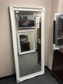 A rectangular white painted mirror,