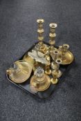 A tray of antique and later brass ware, oil lamp bases,