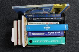 A box of books relating to cameras