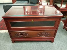 A Chinese carved hardwood entertainment stand,