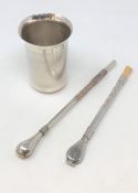 A white metal tea drinking straw stamped 800, another plated example and a plated beaker.