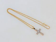 A 9ct gold diamond set crucifix pendant on rope twist chain CONDITION REPORT: 3.