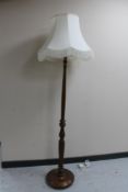 A beech standard lamp with shade