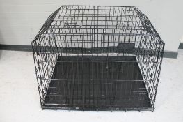 A folding metal dog cage