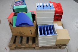 A pallet of office supplies : file boxes, envelopes,